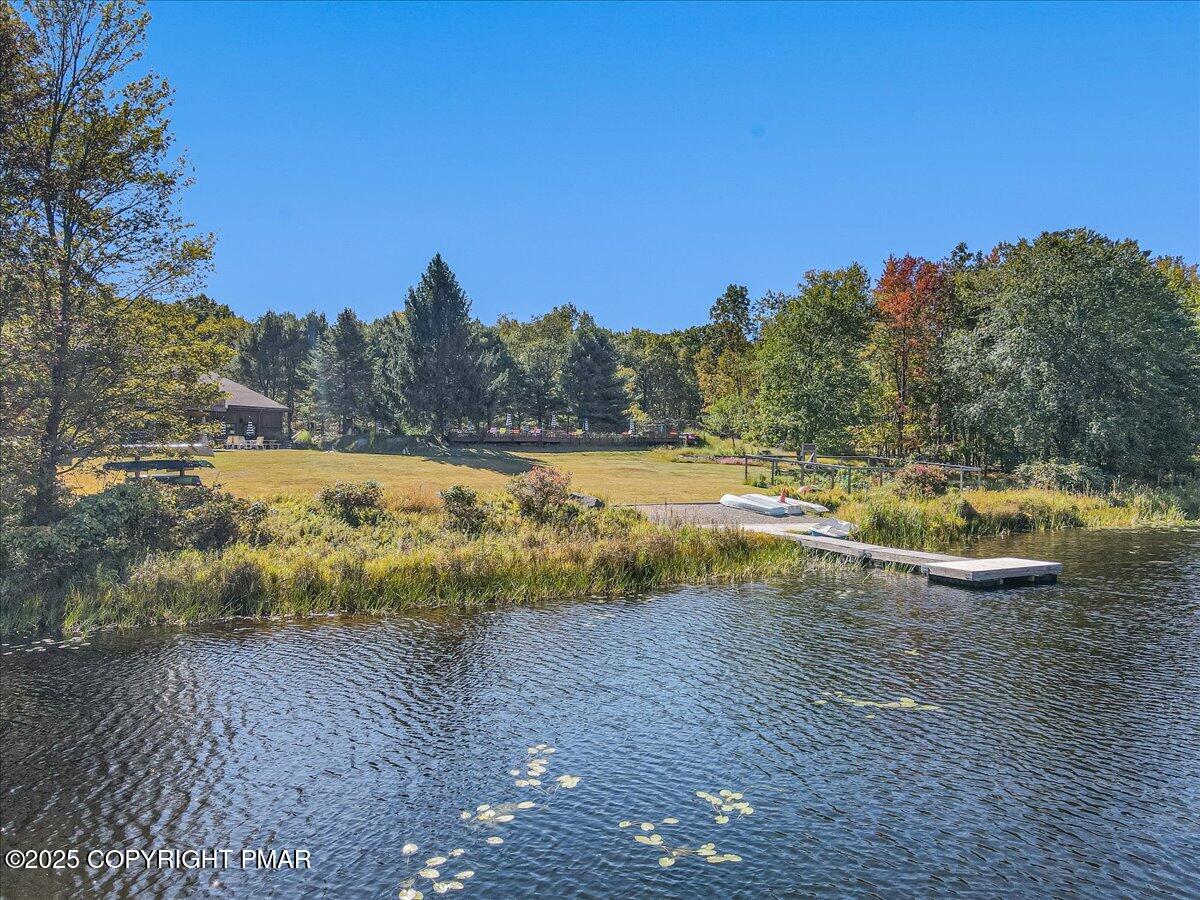 297 Forest Drive Canadensis, PA 18325 - Photo 49 of 58 a view of a lake with trees in the background