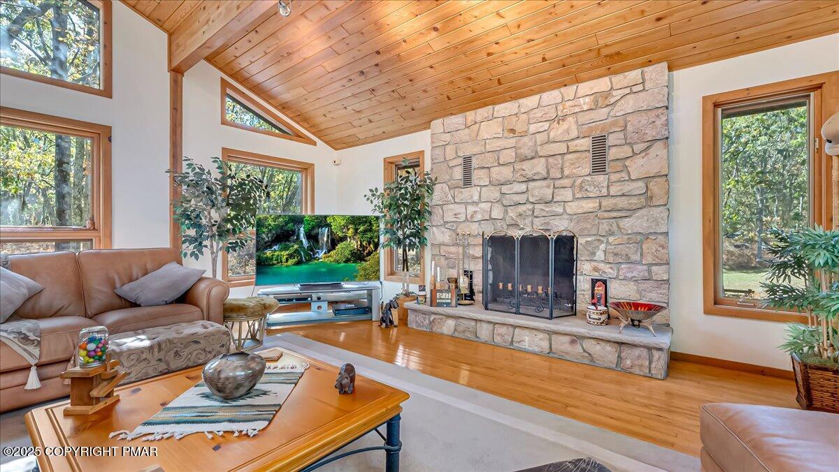 297 Forest Drive Canadensis, PA 18325 - Photo 9 of 58 a living room with furniture and a fireplace