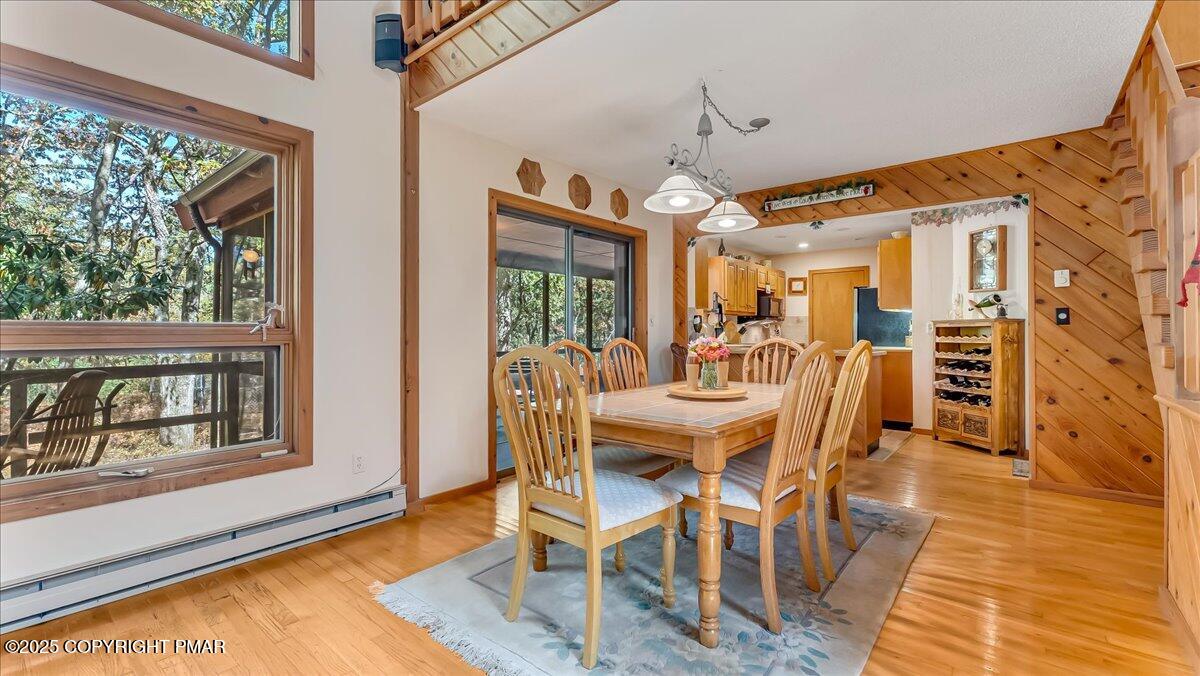 297 Forest Drive Canadensis, PA 18325 - Photo 10 of 58 a view of a dining room with furniture window and wooden floor