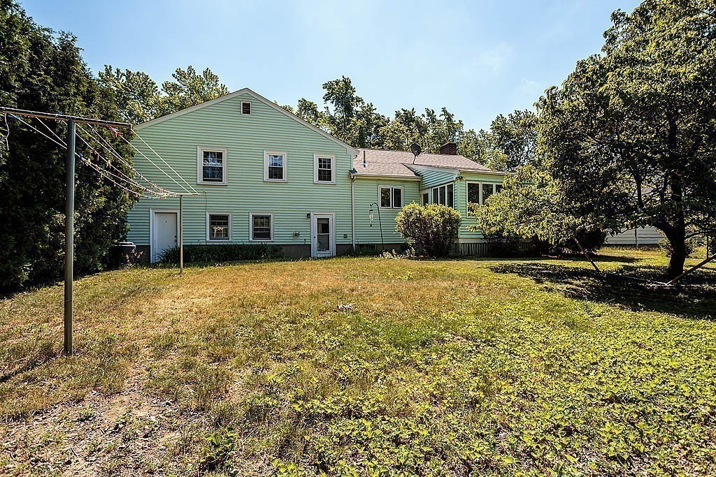 75 Taylor Road Belmont, MA 02478 - Photo 16 of 17 a view of a house with a yard