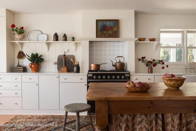 a kitchen with a table and chairs in it