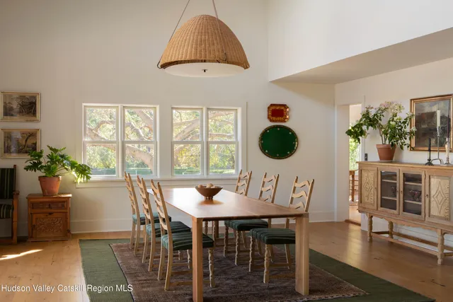 a view of a dining room with furniture window and outside view