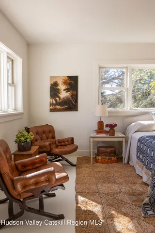 a bathroom with a sink a mirror and a shower