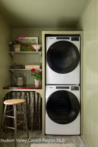 a balcony with table and chairs
