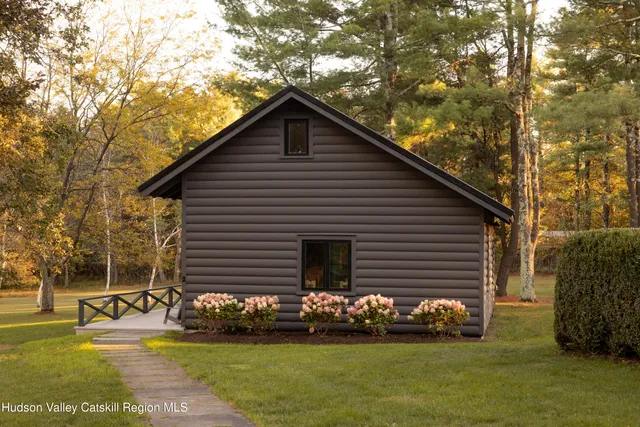 a bedroom with two beds and painted walls