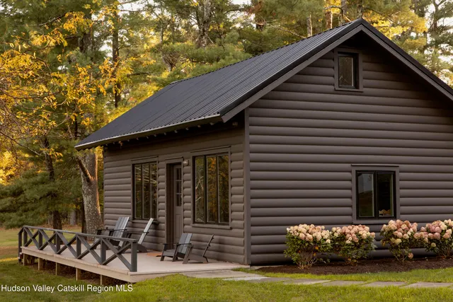 a living room with fireplace furniture and a chandelier