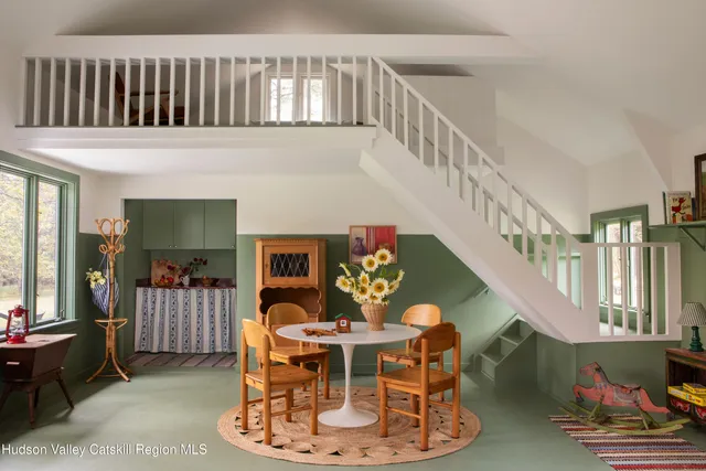 a living room with furniture and a table