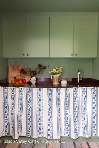 a bedroom with a bed and flat screen tv