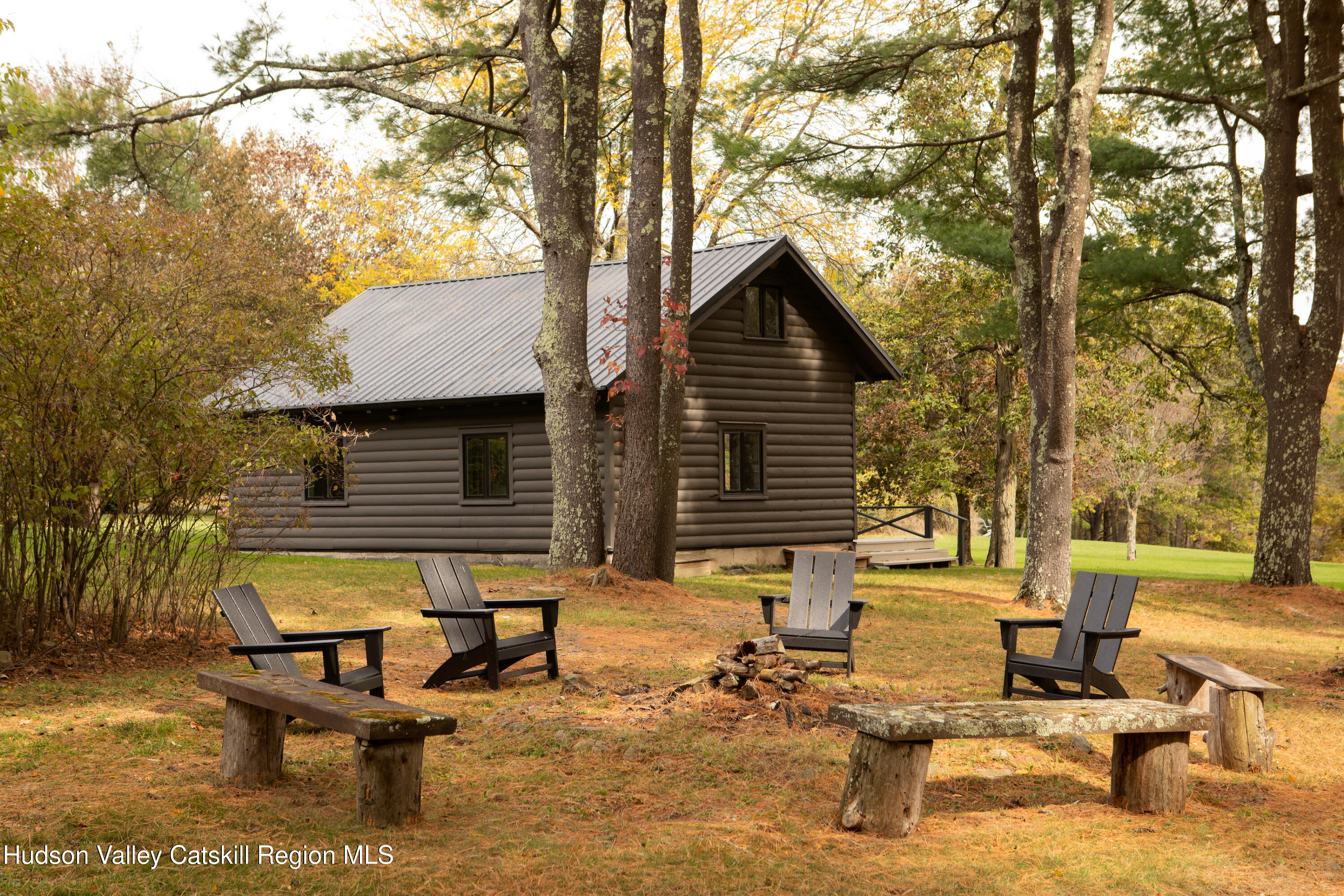 353 Haas Hill Road Climax, NY 12042 - Photo 47 of 50 a view of a backyard with table and chairs and a large tree