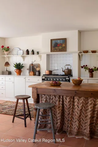 a living room with hard wood flooring and a table