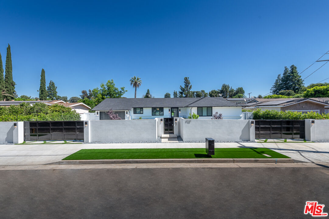 17133 Albers Street Encino, CA 91316 - Photo 1 of 53 a front view of house with yard