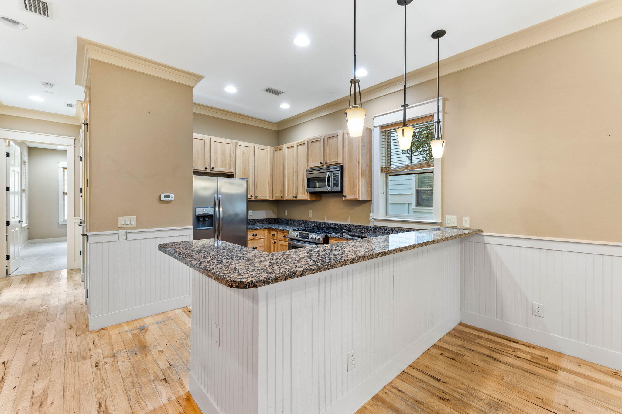 8 Gulf Mark Lane Santa Rosa Beach, FL 32459 - Photo 11 of 44 a kitchen with stainless steel appliances granite countertop a sink a stove and a wooden floors