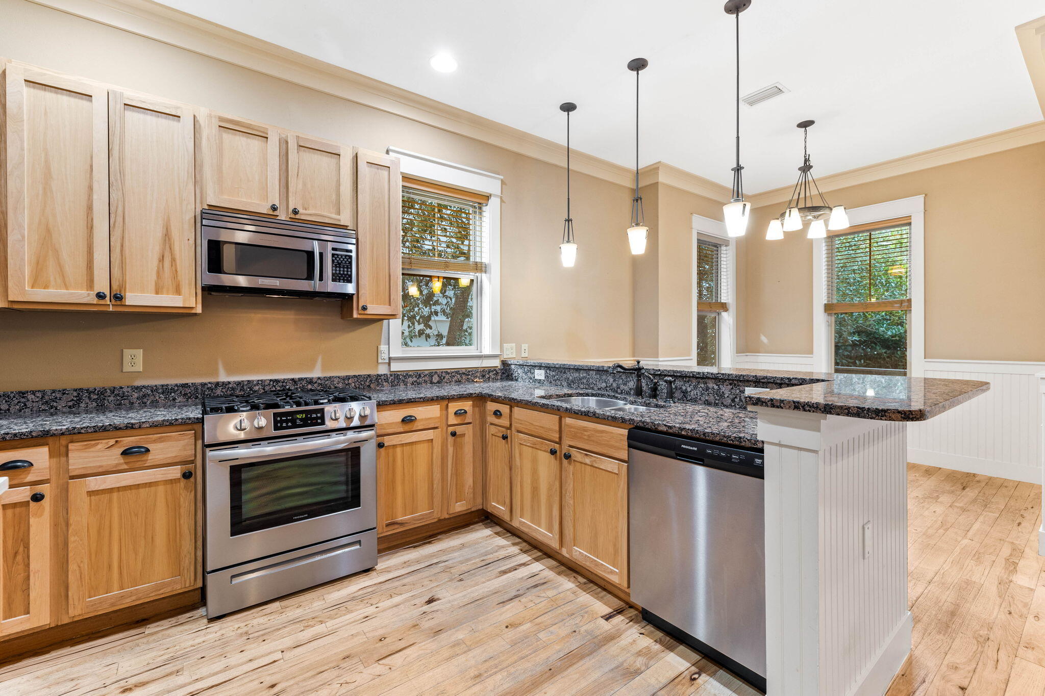 8 Gulf Mark Lane Santa Rosa Beach, FL 32459 - Photo 12 of 44 a kitchen with stainless steel appliances granite countertop a stove and a wooden floors
