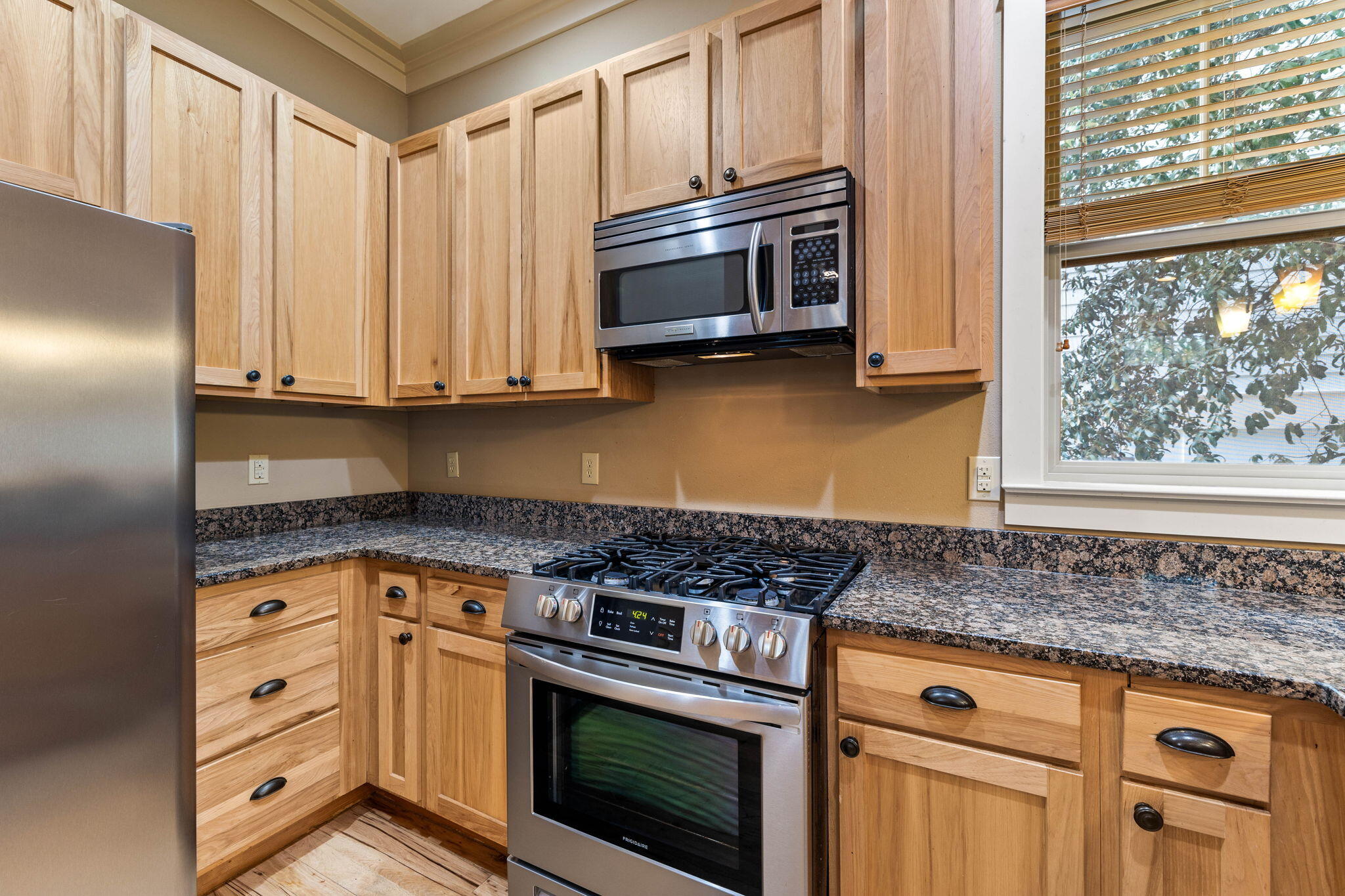 8 Gulf Mark Lane Santa Rosa Beach, FL 32459 - Photo 13 of 44 a kitchen with granite countertop cabinets stainless steel appliances and a window