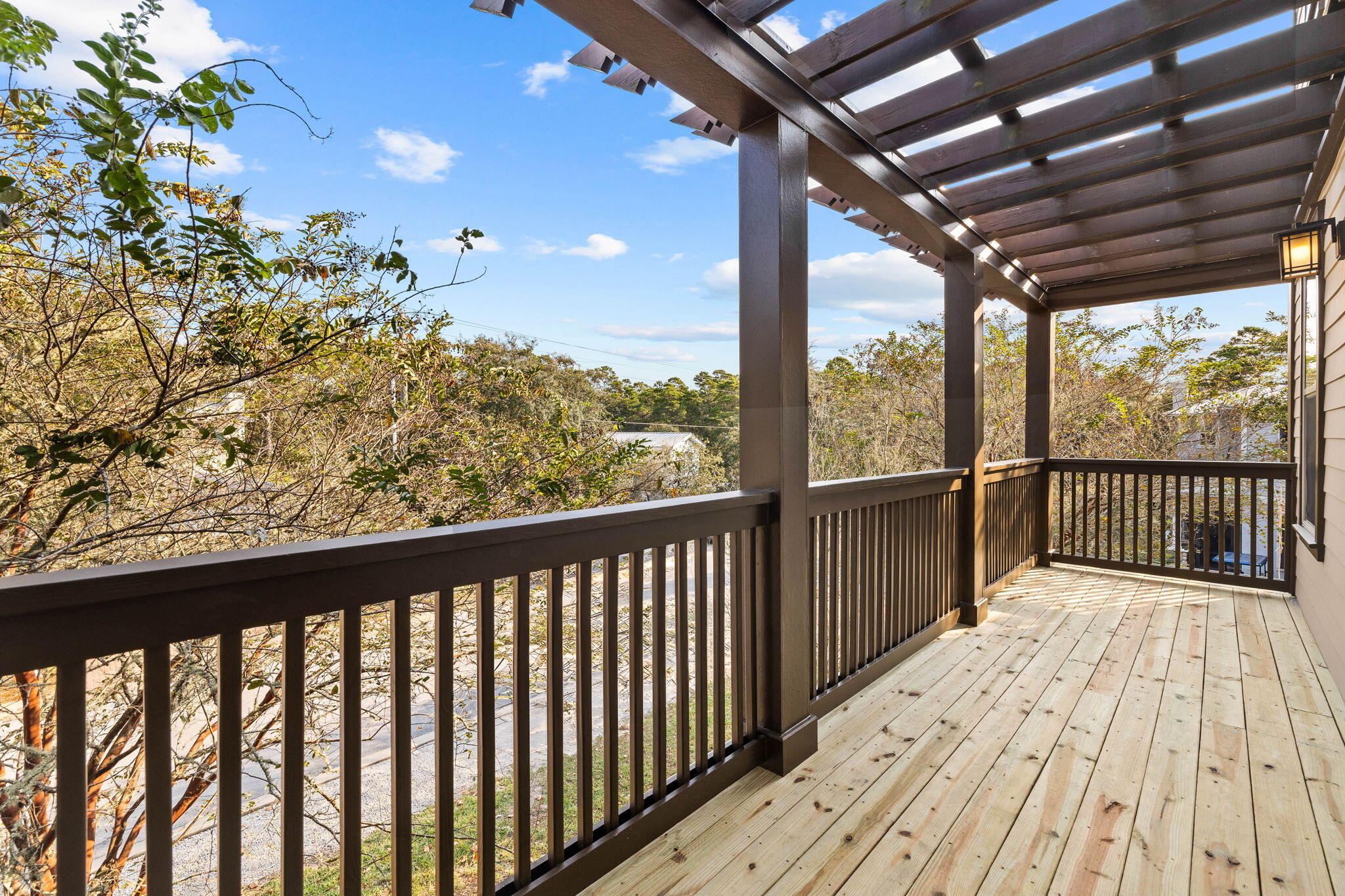 8 Gulf Mark Lane Santa Rosa Beach, FL 32459 - Photo 23 of 44 a view of a porch with wooden floor in front of a house