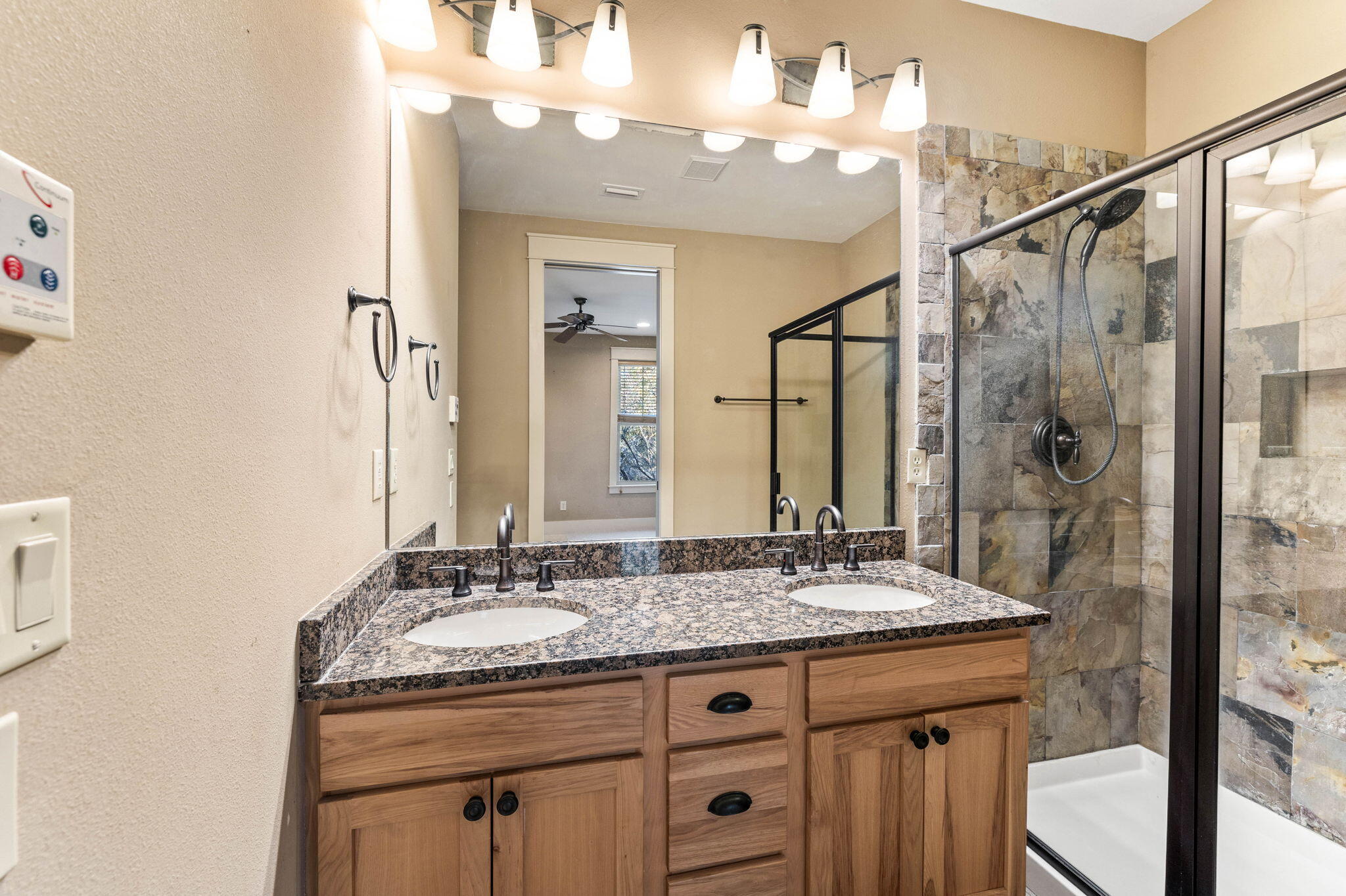 8 Gulf Mark Lane Santa Rosa Beach, FL 32459 - Photo 29 of 44 a bathroom with a granite countertop sink a mirror and a shower