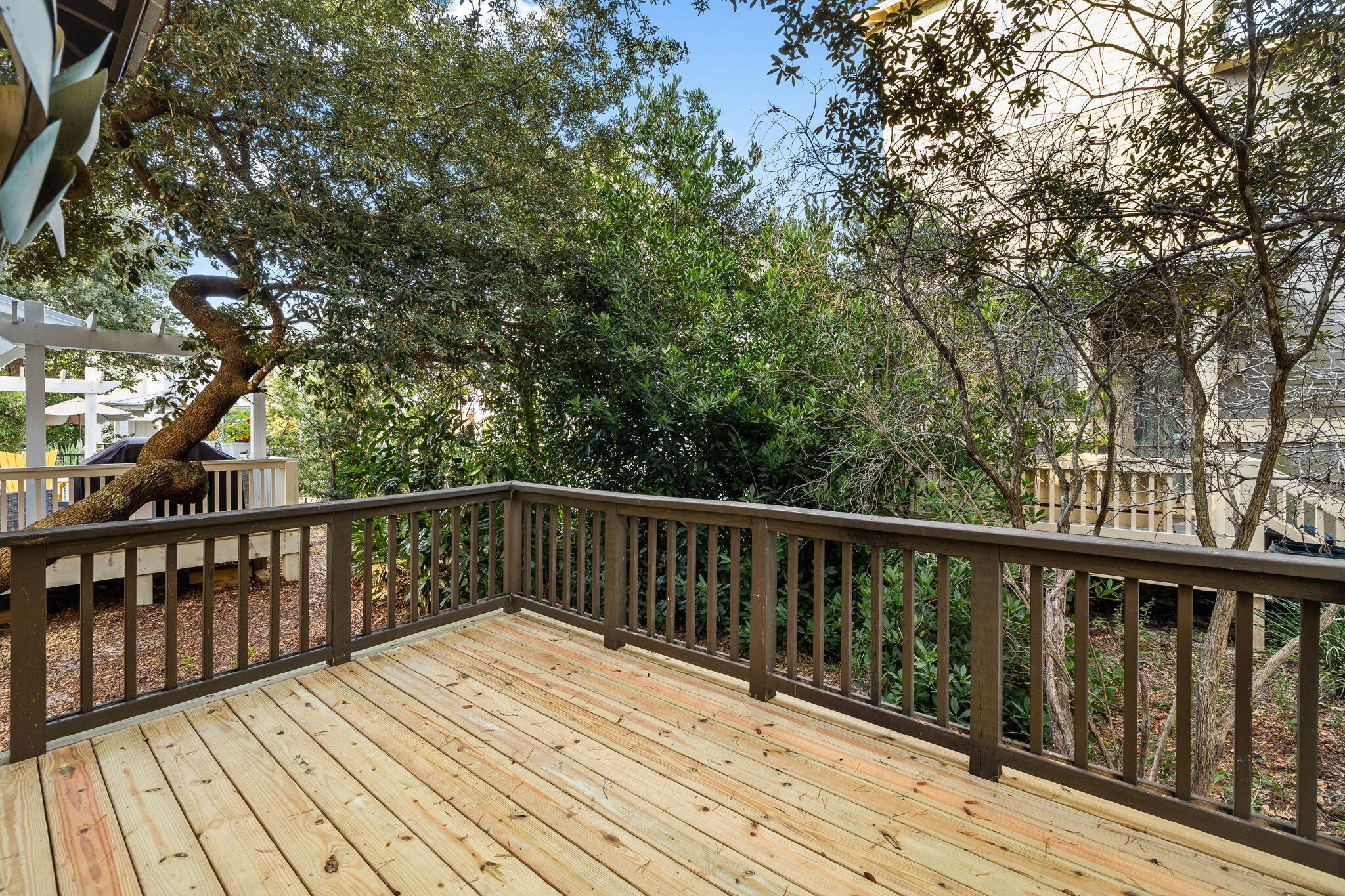 8 Gulf Mark Lane Santa Rosa Beach, FL 32459 - Photo 8 of 44 a balcony with wooden floor and fence
