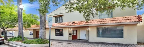 a view of a building with a tree