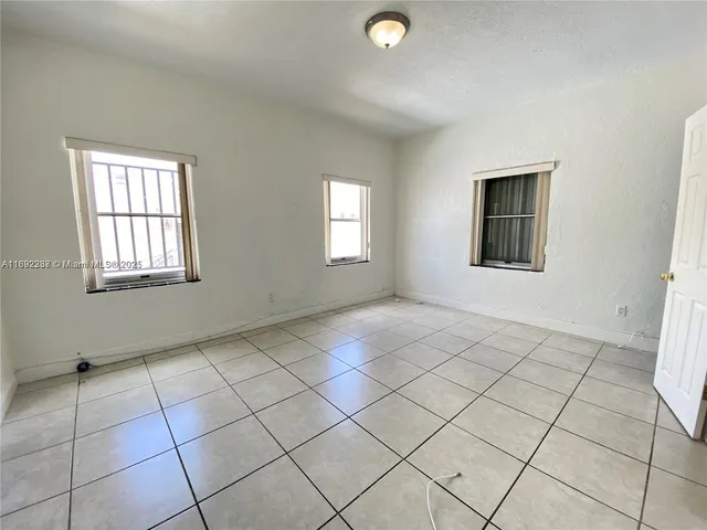 a view of an empty room and window
