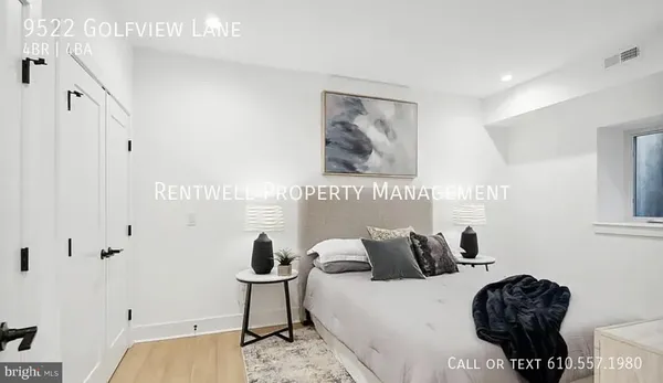 a bedroom with furniture and a potted plant