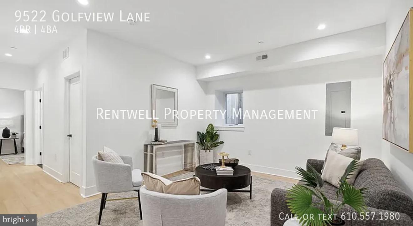 9522 Golfview Lane Philadelphia, PA 19114 - Photo 15 of 26 a living room with furniture and a potted plant