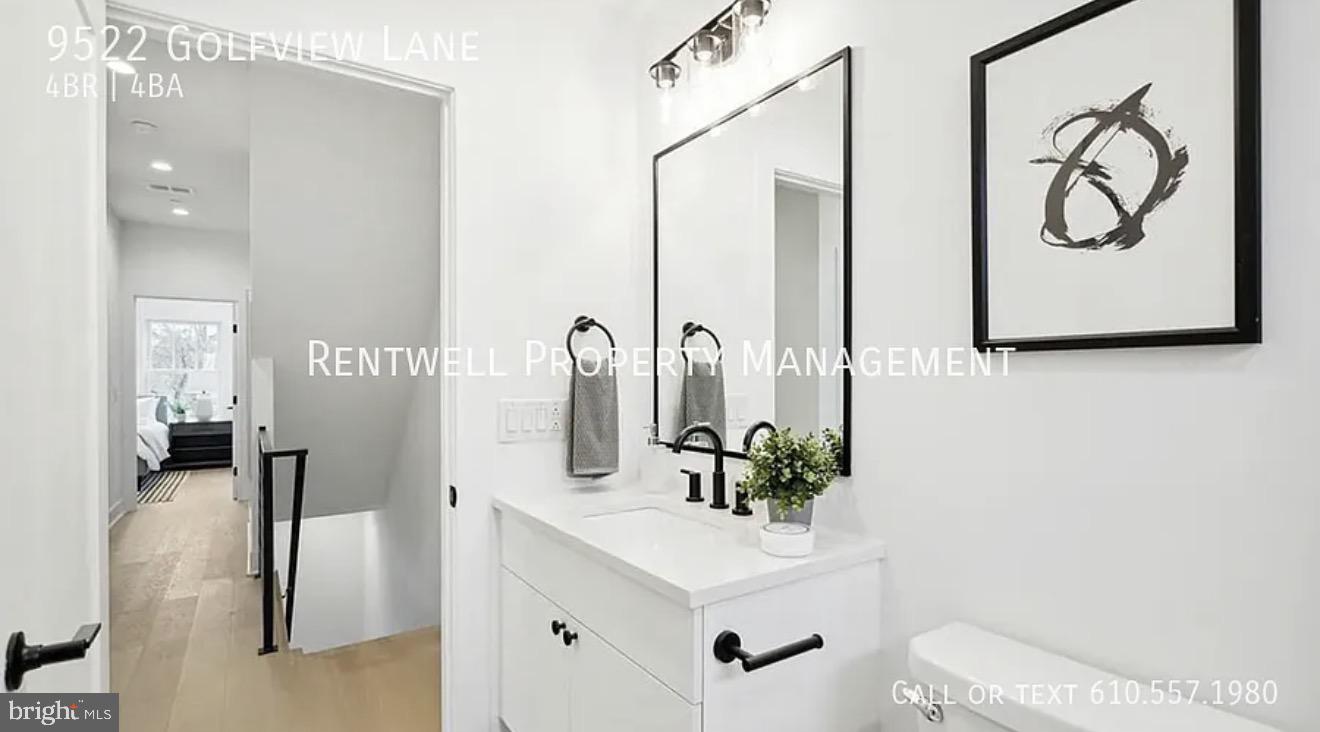 9522 Golfview Lane Philadelphia, PA 19114 - Photo 24 of 26 a bathroom with a sink and a mirror