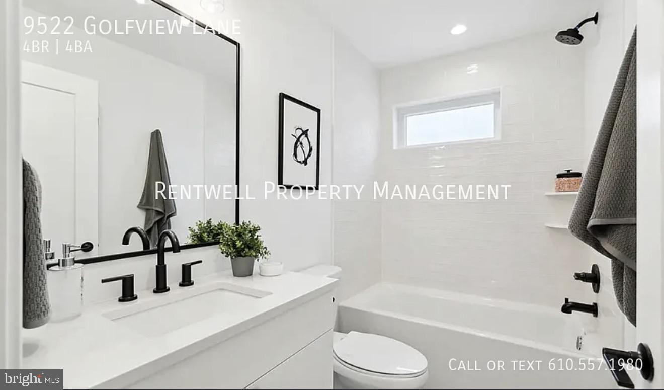 9522 Golfview Lane Philadelphia, PA 19114 - Photo 25 of 26 a bathroom with a sink a toilet and a bathtub