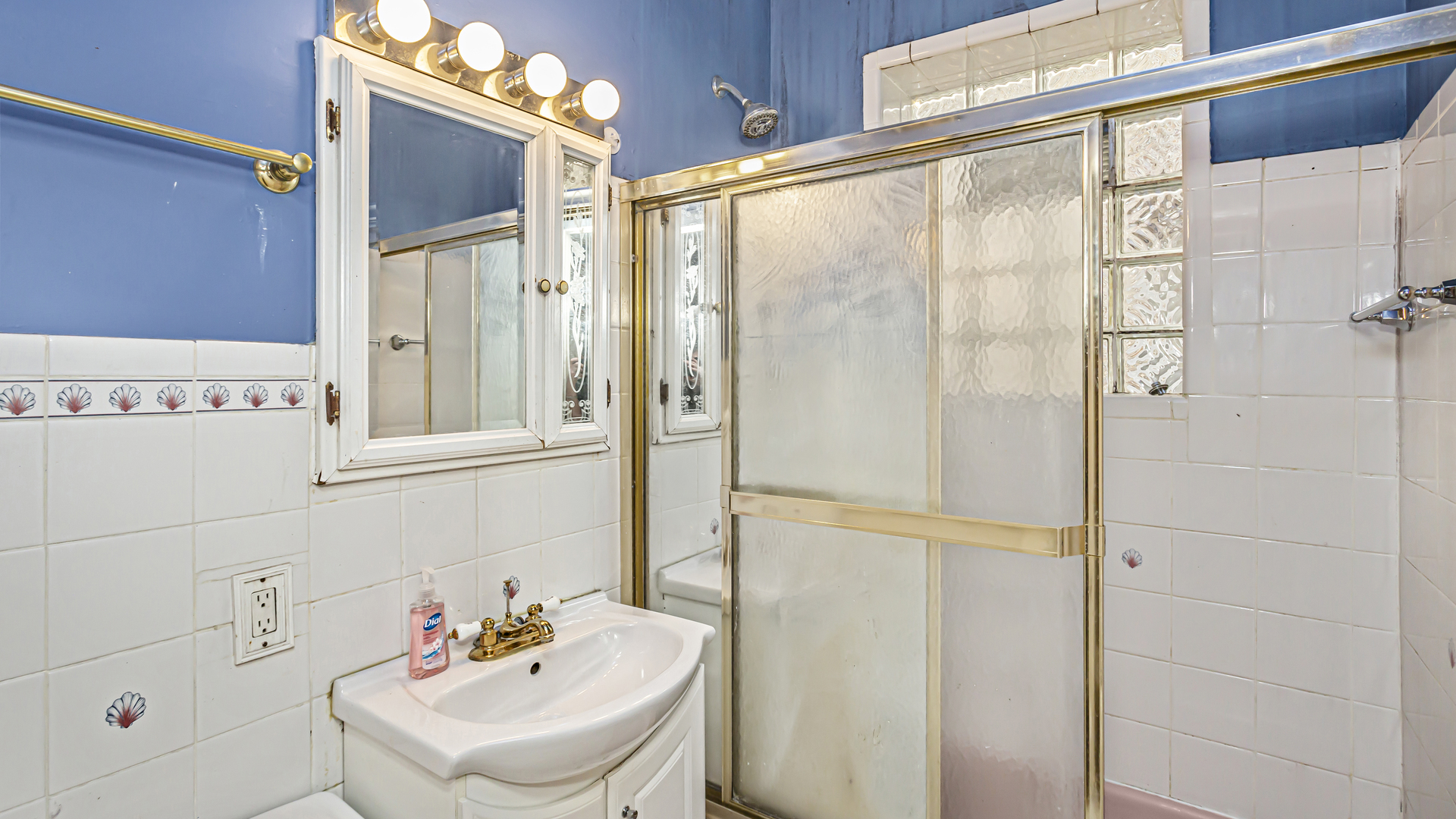 1712 North Monitor Avenue Chicago, IL 60639 - Photo 11 of 33 a bathroom with a shower and a sink