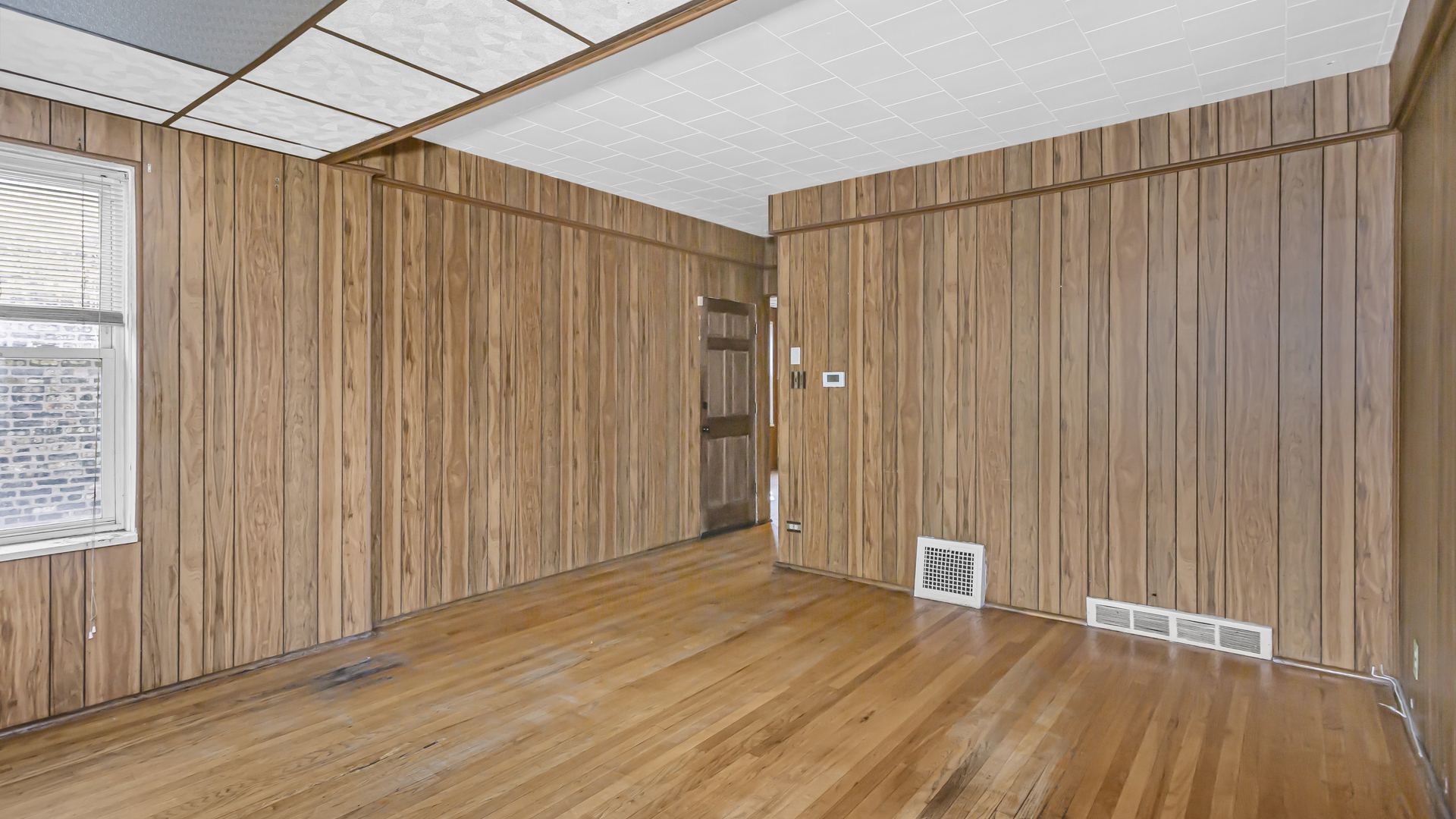 1712 North Monitor Avenue Chicago, IL 60639 - Photo 14 of 33 a view of a room with wooden floor and entryway