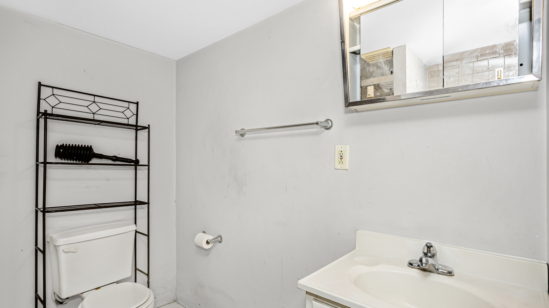 1712 North Monitor Avenue Chicago, IL 60639 - Photo 26 of 33 a bathroom with a bathtub shower sink vanity and toilet
