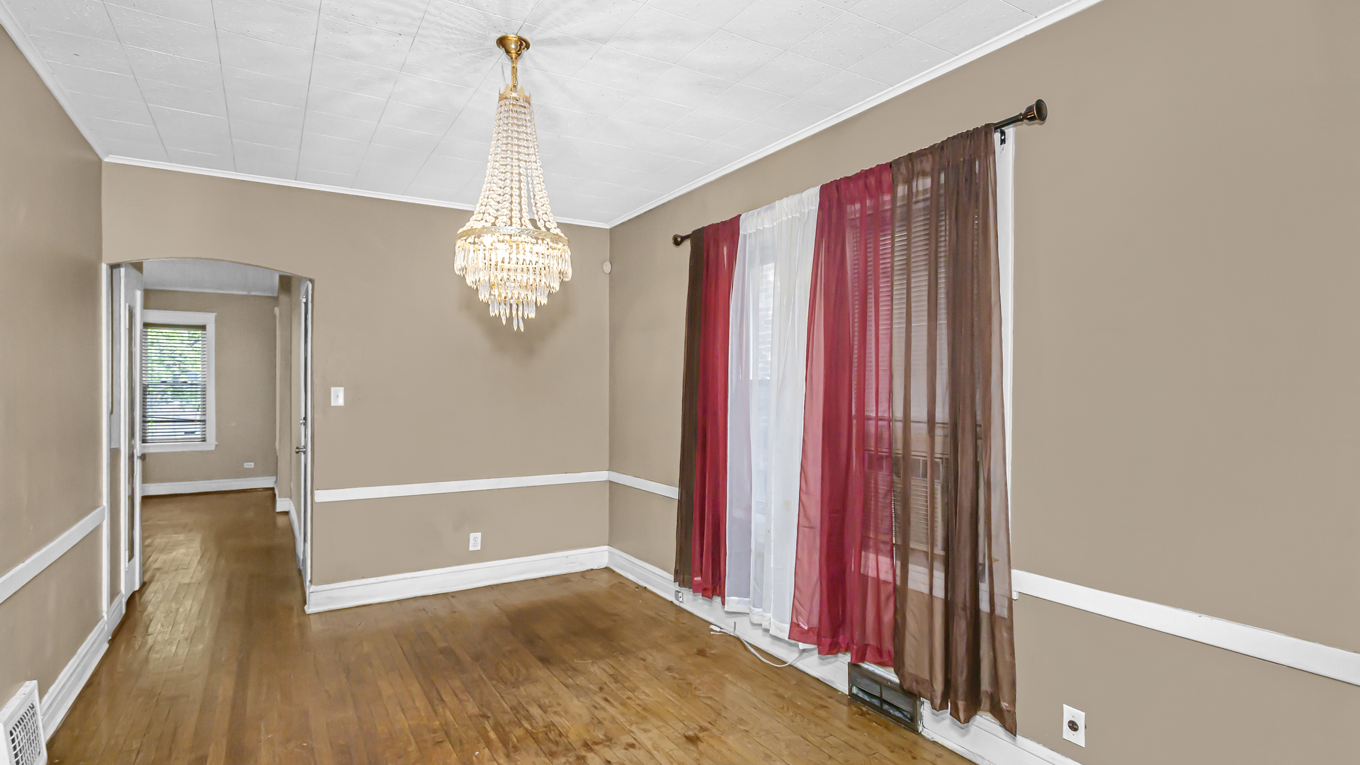 1712 North Monitor Avenue Chicago, IL 60639 - Photo 6 of 33 a view of a room with wooden floor and window
