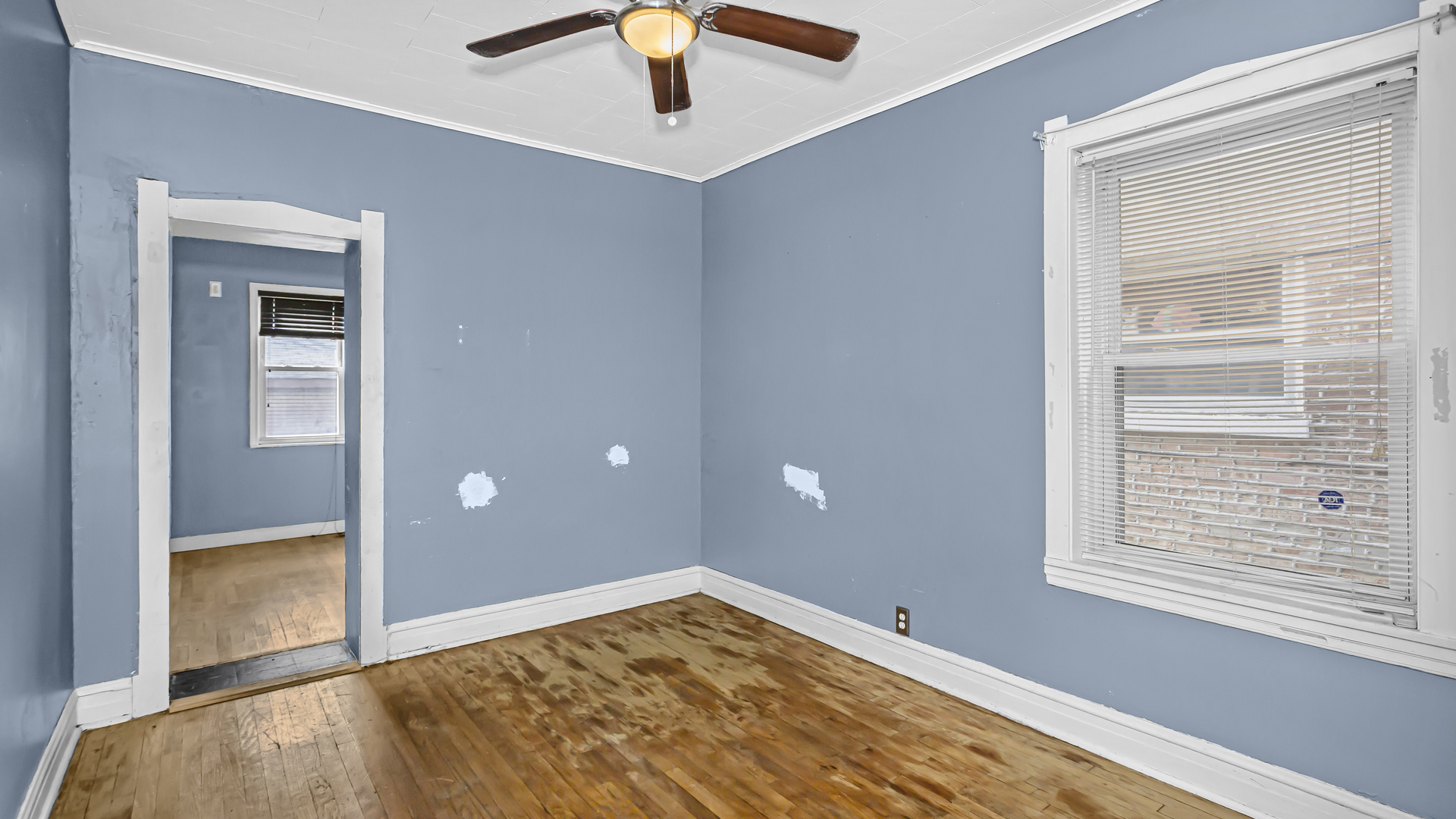 1712 North Monitor Avenue Chicago, IL 60639 - Photo 8 of 33 a view of empty room with window and ceiling fan