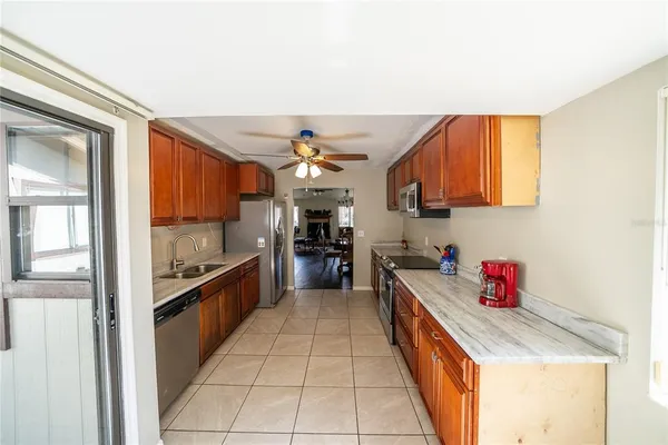 a kitchen with stainless steel appliances granite countertop a sink and cabinets