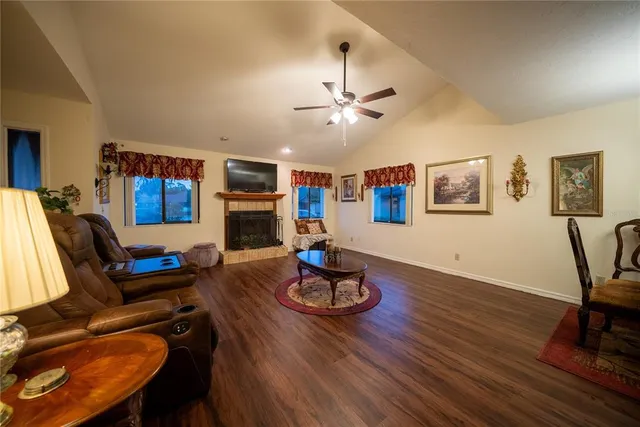 a kitchen with stainless steel appliances granite countertop wooden cabinets a sink and a window