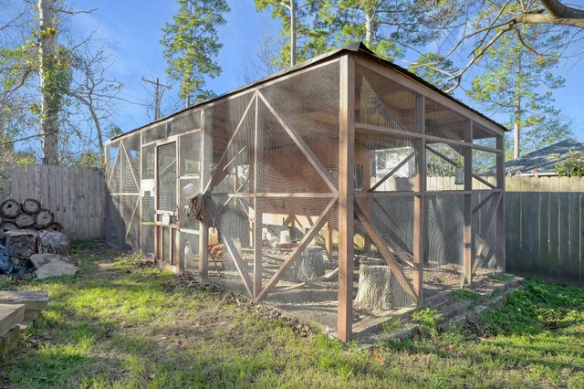 a backyard of a house with lots of green space and outdoor seating