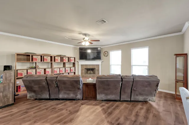 a living room with furniture and a fireplace