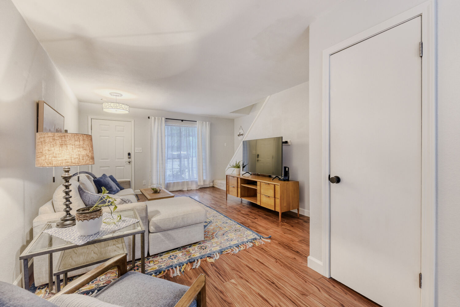 1912 Lightsey Road, Unit 6 Austin, TX 78704 - Photo 9 of 27 a bedroom with furniture and a flat screen tv