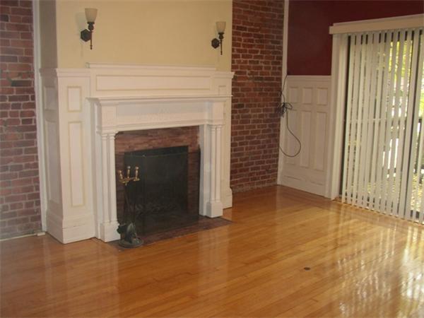a view of a fireplace in an empty room