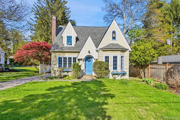 a front view of house with yard and green space