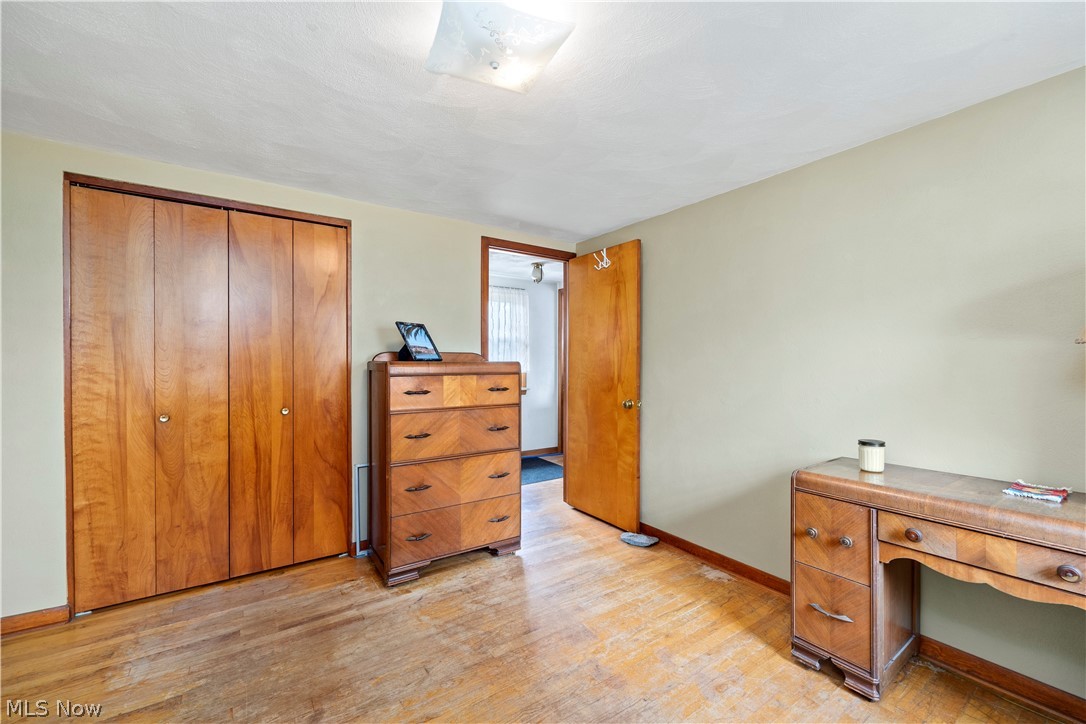 324 Erie Road Vermilion, OH 44089 - Photo 21 of 36 Bedroom with a closet and light hardwood / wood-style flooring