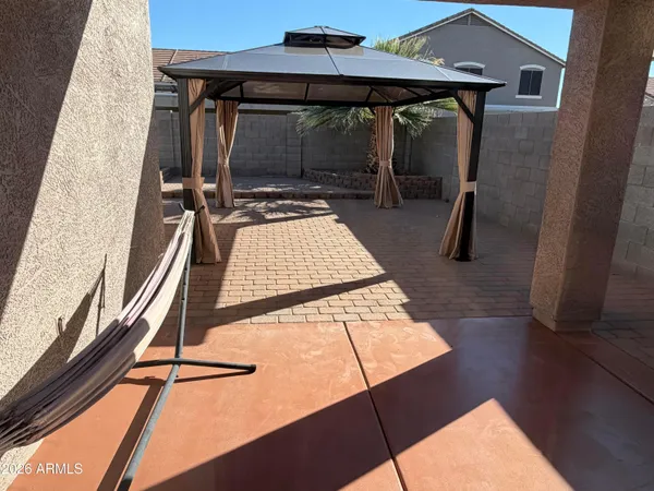 a view of a room with wooden floor and furniture