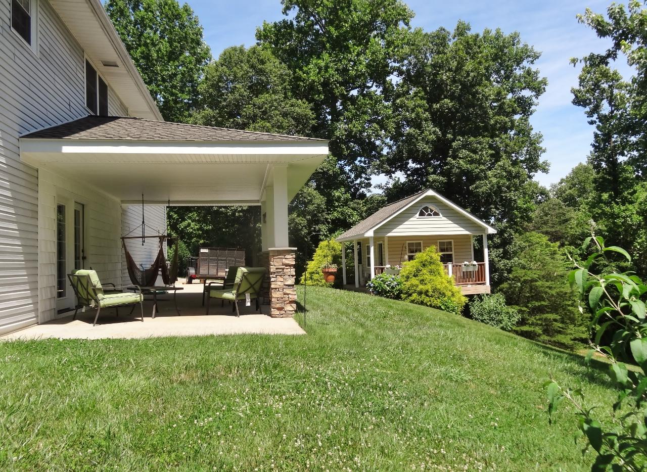 1004 Deep Woods Road Hardy, VA 24101 - Photo 22 of 28 a view of a house with couches yard and front view of a house