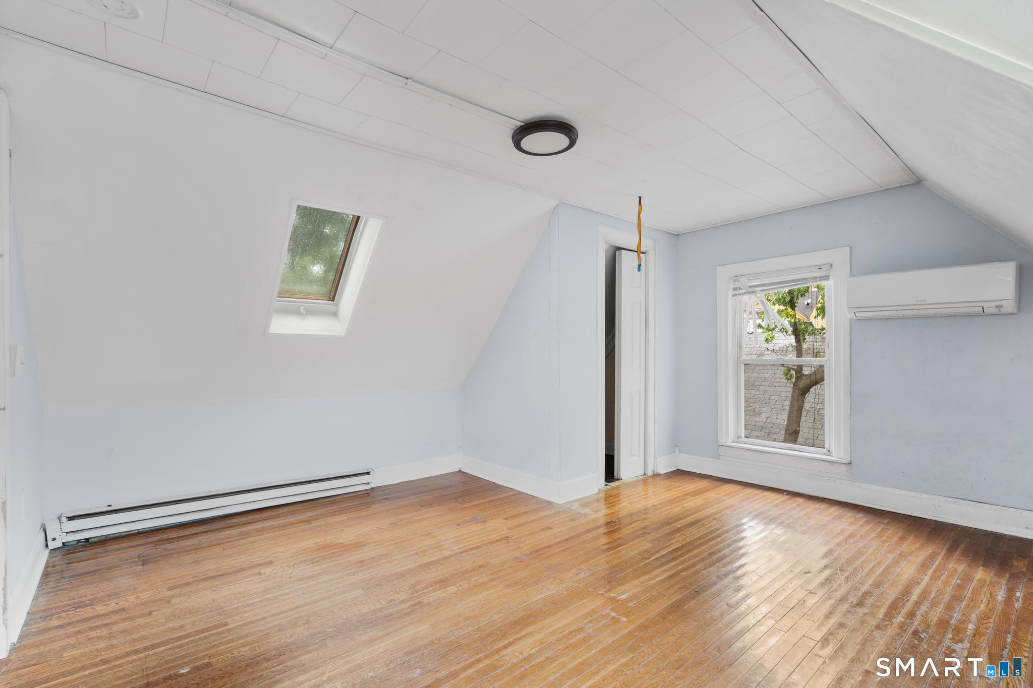 101 Meridian Street Meriden, CT 06451 - Photo 19 of 26 a view of empty room with wooden floor and fan