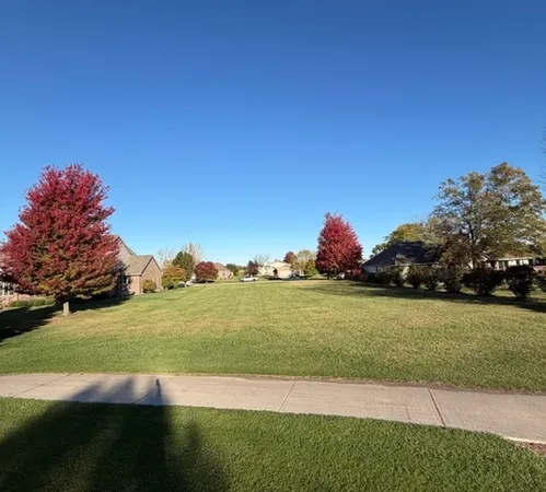 a view of a golf course with a lake