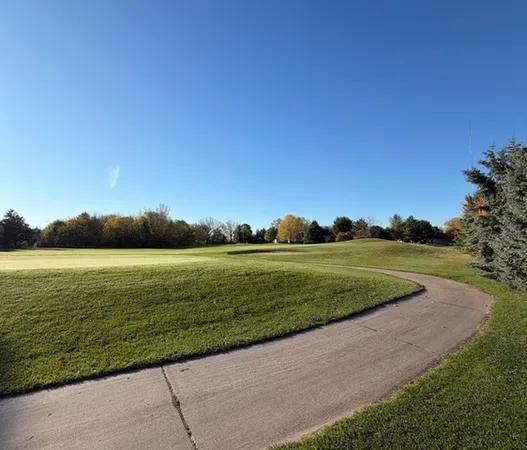 a view of a lake with a big yard