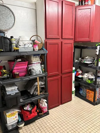 a kitchen area with stainless steel appliances granite countertop a stove and cabinets