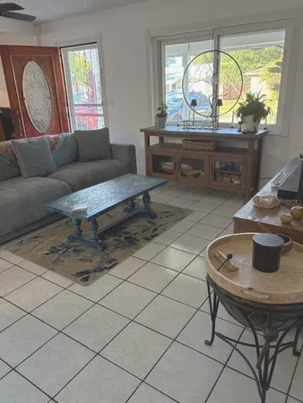 a living room with furniture and a window