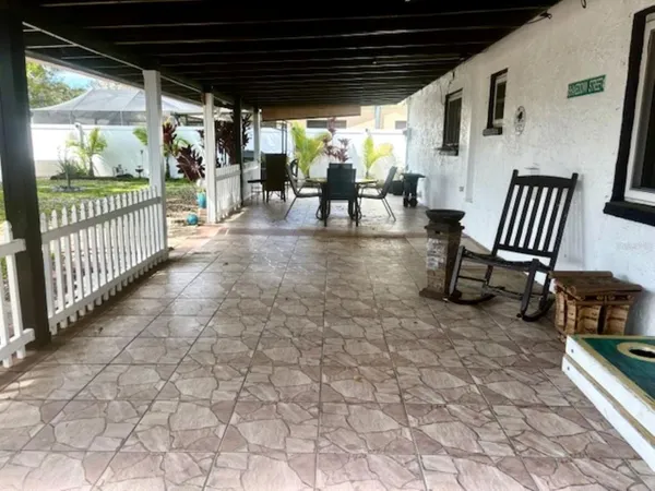 a view of a porch with furniture