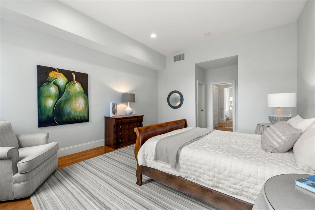 44 Pleasant Street, Unit 1 Marblehead, MA 01945 - Photo 21 of 35 a bedroom with a bed and a couch