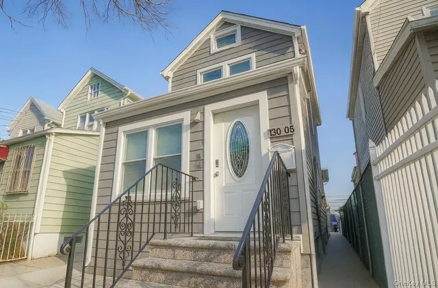 a front view of a house with a balcony
